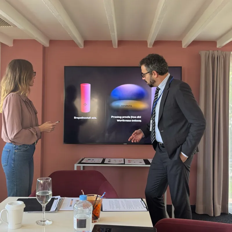 Two investors watching a product demo